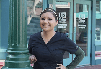 student wearing scrubs